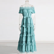A solid color dress for women with a ruffled edge, one shoulder, waist, and lace hem