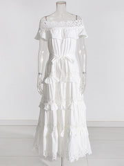 A solid color dress for women with a ruffled edge, one shoulder, waist, and lace hem