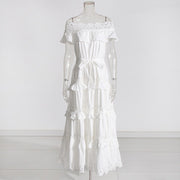 A solid color dress for women with a ruffled edge, one shoulder, waist, and lace hem