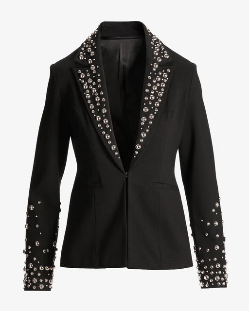 Woman wearing a brown faux suede blazer.